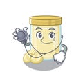 A mascot picture of macadamia nut butter cartoon as a Doctor with tools Royalty Free Stock Photo