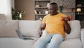 Masculine african american retired sportsman doing biceps curls pumping muscles with dumbbells lifting weights