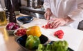 Masculine hands of the chef cutting paper in the kitchen Royalty Free Stock Photo