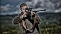 Masculine hobby activity. Man hunter aiming rifle nature background. Experience and practice lends success hunting. Guy Royalty Free Stock Photo