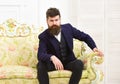 Masculinity concept. Man with beard and mustache wearing classic suit, stylish fashionable outfit. Macho attractive and Royalty Free Stock Photo