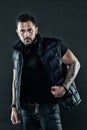 Masculinity and fashion concept. Tattoo brutal attribute. Tattoo art concept. Macho unshaven brutal wear vest. Man Royalty Free Stock Photo