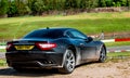 Maserati Granturismo pared next to a racetrack Royalty Free Stock Photo