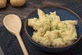 Mash potatoes with a wooden spoon Royalty Free Stock Photo