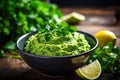 mashed avocado in a bowl with lime and cilantro