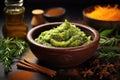 mashed avocado in a bowl with spices