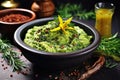 mashed avocado in a bowl with spices and herbs