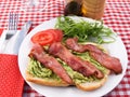 Mashed avocado on toast and bacon Royalty Free Stock Photo