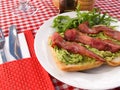 Mashed avocado on toast and bacon Royalty Free Stock Photo