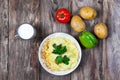 Mashed boiled potato with herbs. milk and vegetables