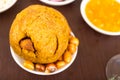 Mashed fried banana with pork meat, traditional bolon and fried corn