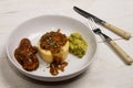 Mashed potato, onion gravey, grilled sausages, mushy peas and chopped rosemary Royalty Free Stock Photo