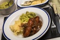 Mashed potato, onion gravey, grilled sausages and mushy peas Royalty Free Stock Photo