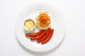 Mashed potato and roasted sausage or bratwurst on white plate Royalty Free Stock Photo