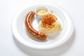 Mashed potato and roasted sausage or bratwurst on white plate Royalty Free Stock Photo