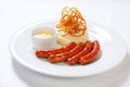 Mashed potato and roasted sausage or bratwurst on white plate Royalty Free Stock Photo