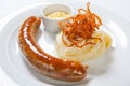 Mashed potato and roasted sausage or bratwurst on white plate Royalty Free Stock Photo