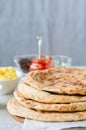 Mashed potato and sheep cheese filling flatbread on a white stone background. Royalty Free Stock Photo