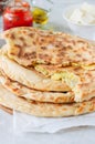 Mashed potato and sheep cheese filling flatbread on a white stone background. Royalty Free Stock Photo