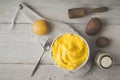 Mashed potatoes in the bowl on the white wooden table with fork and bottle of milk top view Royalty Free Stock Photo