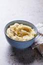 Mashed potatoes with butter and pepper in blue bowl Royalty Free Stock Photo