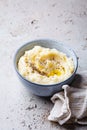 Mashed potatoes with butter and pepper in blue bowl Royalty Free Stock Photo