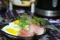 Mashed potatoes with fried sausage and fried egg in a plate Royalty Free Stock Photo