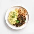 Mashed potatoes with roasted beef liver and fried onion rings Royalty Free Stock Photo