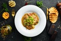 Mashed potatoes with veal sauce and meat on a plate. Royalty Free Stock Photo