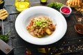 Mashed potatoes with veal sauce and meat on a plate. Royalty Free Stock Photo