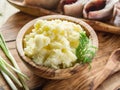 Mashed potatoes in a wooden bowl on the service tray. Royalty Free Stock Photo