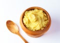 Mashed potatoes in wooden bowl on table with spices Royalty Free Stock Photo