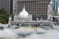 Masjid Jamek Mosque, Kuala Lumpur, Malaysia: 31 March 2019: Masjid Jamek Mosque at junction of Gombak and Klang rivers with mist Royalty Free Stock Photo