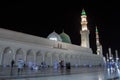 Masjid Nabawi at night time. People walking at night at the Prophet& x27;s Mosque in Medina Royalty Free Stock Photo