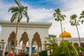 Masjid At-Taqwa mosque with its Golden dome and palm trees. Miri city, Borneo, Sarawak, Malaysia