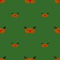 Mask deer brown color geometric seamless pattern on green background. Children graphic design element for different purposes