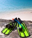 Mask,flippers, tube-lay on sand on background of ocean Royalty Free Stock Photo