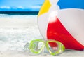 Mask goggles and color ball on a sand on beach background Royalty Free Stock Photo