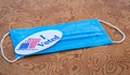 Mask with I voted sticker on table