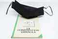 Mask of the new Covid 19 or Coronavirus with the book of the Spanish constitution