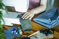 Mask sewing and making homemade covid mask concept. Sewing an individual antibacterial mask from colored fabric at home