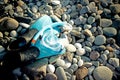 Mask, snorkel and fins lie on pebble beach Royalty Free Stock Photo