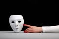 The mask is a symbol of duplicity for the false man. Royalty Free Stock Photo