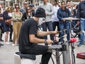 Masked anonymous percussionist performs in Duomo square Milan