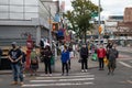 Masked Asian People Waiting to Cross the Street in Flushing Queens of New York City