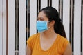 Masked Asian woman prevent germs. Tiny Particle or virus 19 protection. Concept of Combating illness Royalty Free Stock Photo