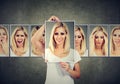 Masked blonde young woman expressing different emotions Royalty Free Stock Photo