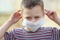 masked child from coronavirus and air. Protection against PM 2.5 air polluted from the virus in Europe Royalty Free Stock Photo