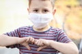 masked child from coronavirus and air. Protection against PM 2.5 air polluted from the virus in Europe Royalty Free Stock Photo