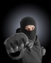 Masked criminal with clenched fist Royalty Free Stock Photo